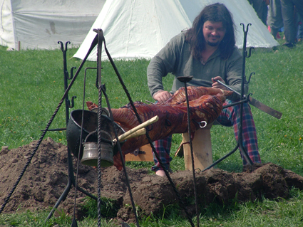 Spit roasting a whole pig - it took eight hours to cook and was wonderful!